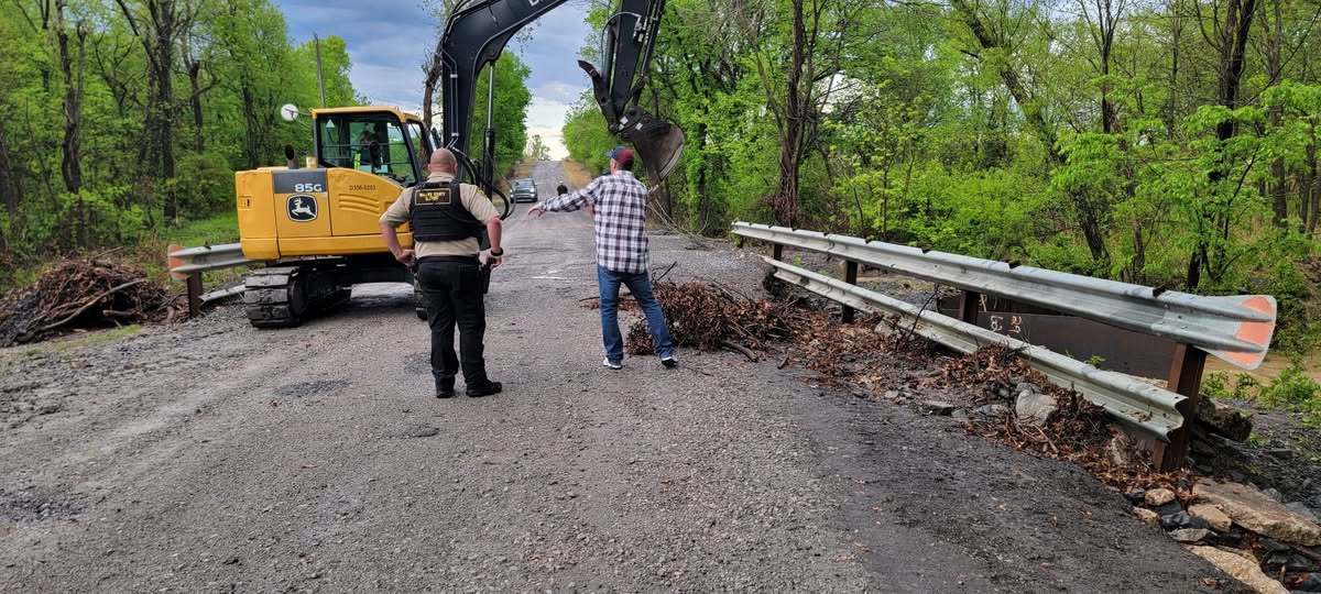 Commissioner Hanning coordinating with the Sheriff's Office at a bridge repair site