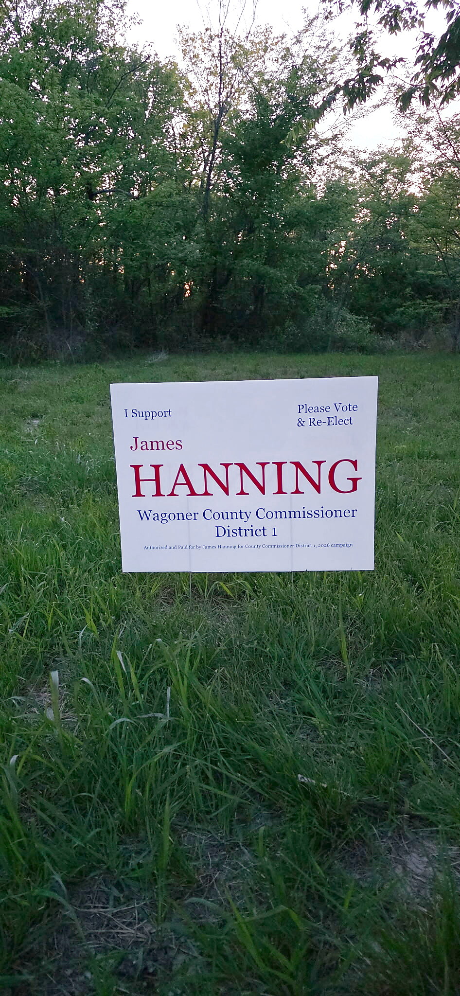 A 2026 'I Support James Hanning, Wagoner County Commissioner District 1' yard sign in a Wagoner County yard
